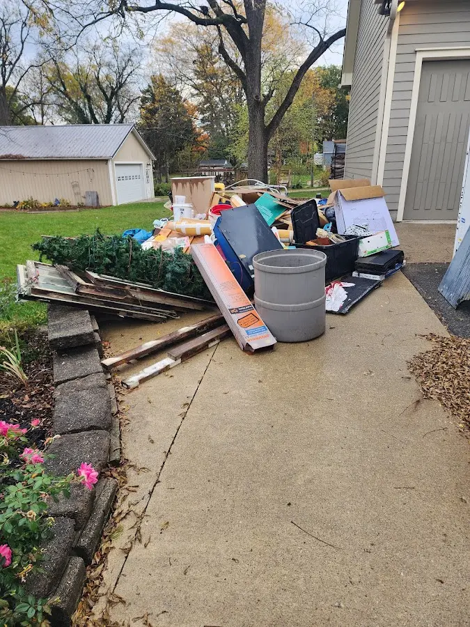Dumpster being loaded with debris for Residential Dumpster Rental in Ash